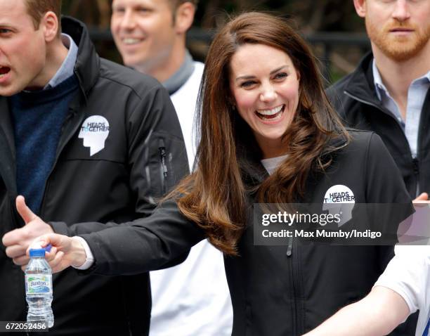 Catherine, Duchess of Cambridge hands out water to runners taking part in the 2017 Virgin Money London Marathon on April 23, 2017 in London, England....