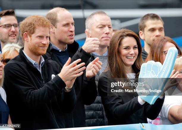 Prince Harry, Prince William, Duke of Cambridge and Catherine, Duchess of Cambridge cheer on runners talking part in the 2017 Virgin Money London...