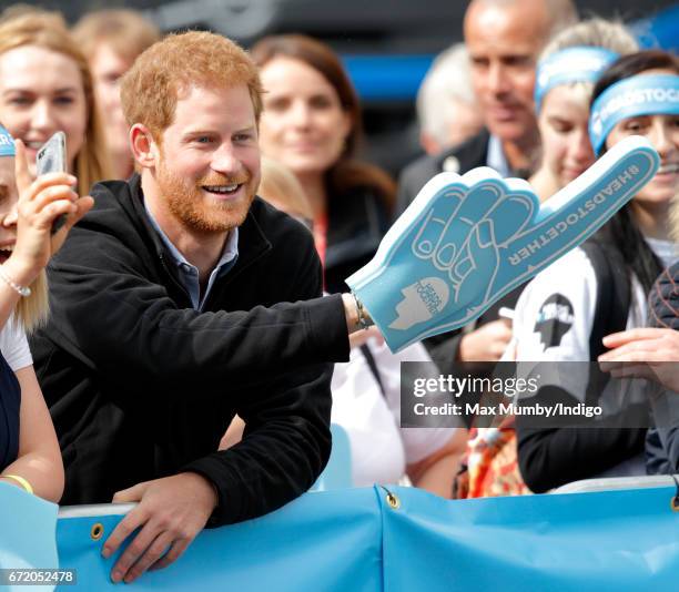 Prince Harry cheers on runners talking part in the 2017 Virgin Money London Marathon on April 23, 2017 in London, England. The Heads Together mental...