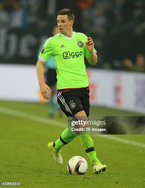 Nick Viergever of Ajax Amsterdam controls the ball during the UEFA Europa League quarter final second leg match between FC Schalke 04 and Ajax...