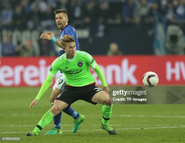 Matthijs de Ligt of Ajax Amsterdam and Guido Burgstaller of Schalke controls the ball during the UEFA Europa League quarter final second leg match...