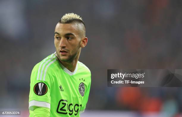 Hakim Ziyech of Ajax Amsterdam looks on during the UEFA Europa League quarter final second leg match between FC Schalke 04 and Ajax Amsterdam at...