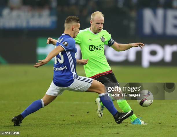 Davy Klaassen of Ajax Amsterdam and Donis Avdijaj of Schalke battle for the ball during the UEFA Europa League quarter final second leg match between...