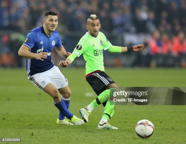 Sead Kolasinac of Schalke and Hakim Ziyech of Ajax Amsterdam battle for the ball during the UEFA Europa League quarter final second leg match between...