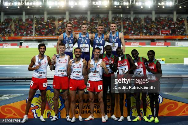 Team USA, first place, team Kenya, second place, and team Poland, third place celebrate after the Men's 4x800 Metres Relay Final during the IAAF/BTC...
