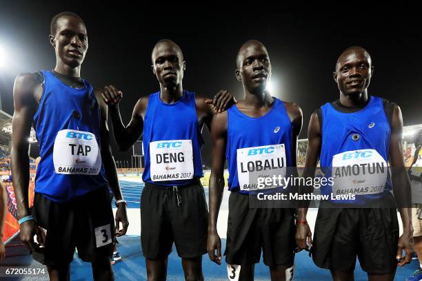 Gai Nyang Tap, Wiyual Puok Deng, Dominic Lokinyomo Lobalu and Paulo Amotun Lokoro of team Athlete Refugee pose for a photo after the Men's 4x800...