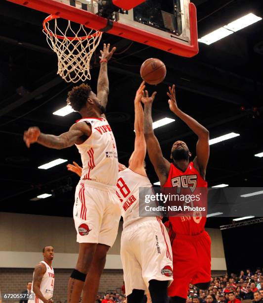 McAllen, TX C.J. Leslie of the Raptors 905 has his shot blocked by Kyle Wiltjer of the Rio Grande Valley Vipers as Chris Walker backs him up during...