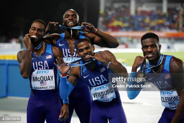 David Verburg, Tony McQuay, Kyle Clemons and LaShawn Merritt of the USA celebrate on the podium after placing first in the Men's 4x400 Metres Relay...