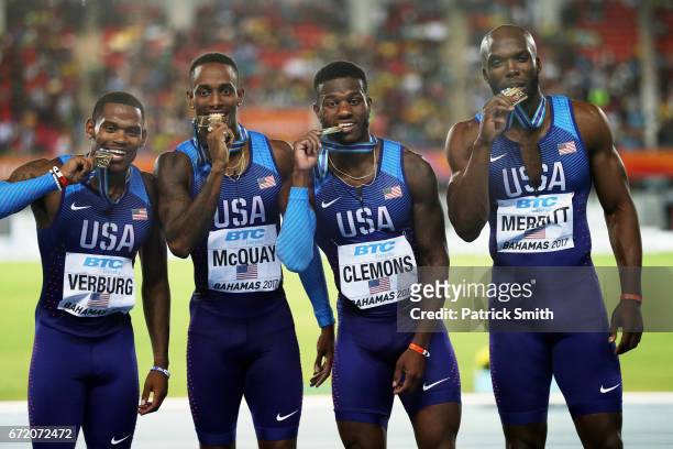 David Verburg, Tony McQuay, Kyle Clemons and LaShawn Merritt of the USA celebrate on the podium after placing first in the Men's 4x400 Metres Relay...