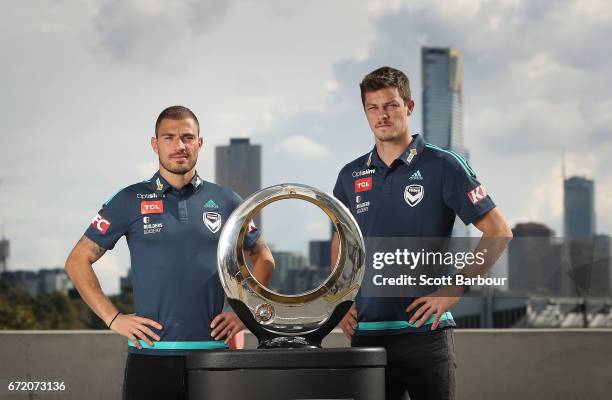 James Troisi and James Donachie pose with the Hyundai A-League Championship Trophy during a Melbourne Victory A-League media opportunity at AAMI Park...