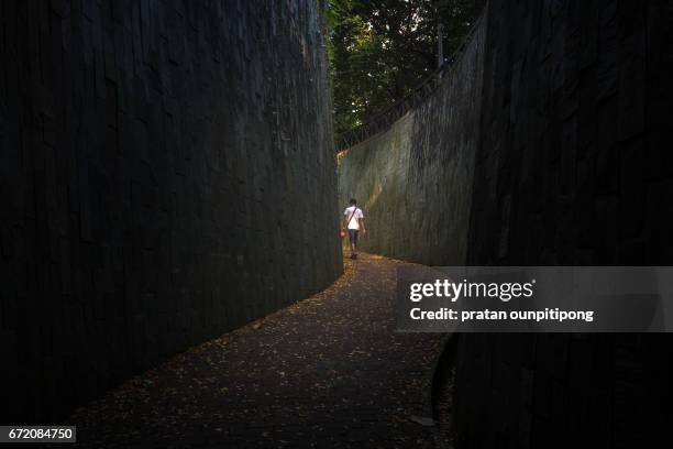 man in the s curve - singapore alley stock pictures, royalty-free photos & images