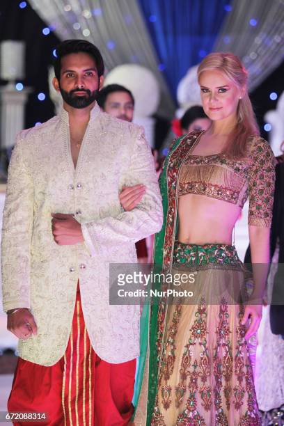Models showcase ornate outfits during the East Meets West Fashion Show held in Mississauga, Ontario, Canada, on April 23, 2017. The show featured the...