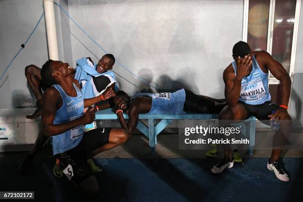 Onkabetse Nkobolo of Botswana shares a laugh with teammates Baboloki Thebe , Karabo Sibanda and Isaac Makwala before collecting their second place...