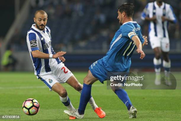 Porto's Portuguese midfielder Andre Andre compete the ball with Feirense player Cris during the Premier League 2016/17 match between FC Porto and CD...