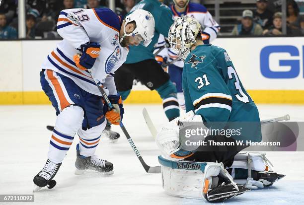 Goalie Martin Jones of the San Jose Sharks blocks the shot of Patrick Maroon of the Edmonton Oilers during the third period in Game Four of the...