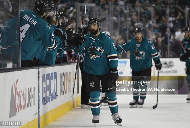 David Schlemko of the San Jose Sharks is congratulated by teammates after he scored a goal against the Edmonton Oilers during the third period in...