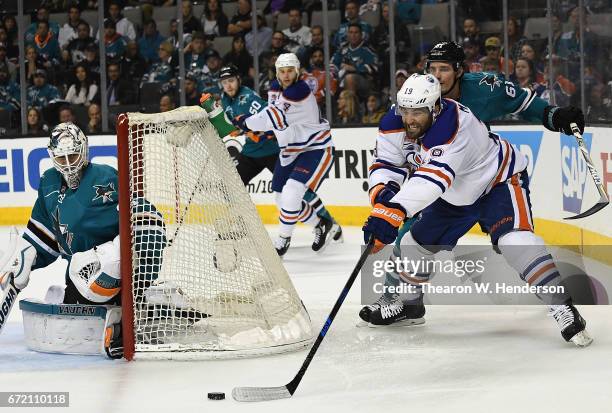 Goalie Martin Jones of the San Jose Sharks blocks the shot of Patrick Maroon of the Edmonton Oilers during the third period in Game Four of the...