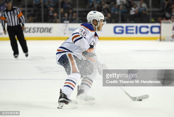Drake Caggiula of the Edmonton Oilers skates with control of the puck against the San Jose Sharks during the third period in Game Four of the Western...