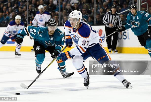 Connor McDavid of the Edmonton Oilers skates with control of the puck against the San Jose Sharks during the first period in Game Four of the Western...