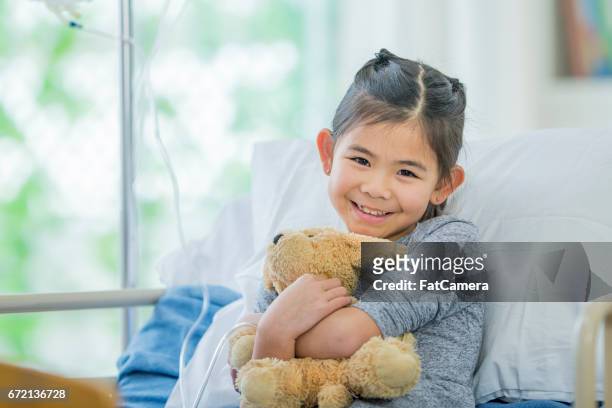 girl in hospital - child teddy bear stock pictures, royalty-free photos & images