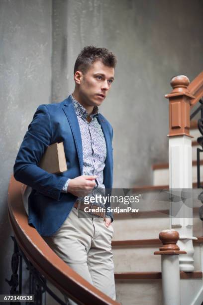 handsome bookworm - menswear stock pictures, royalty-free photos & images