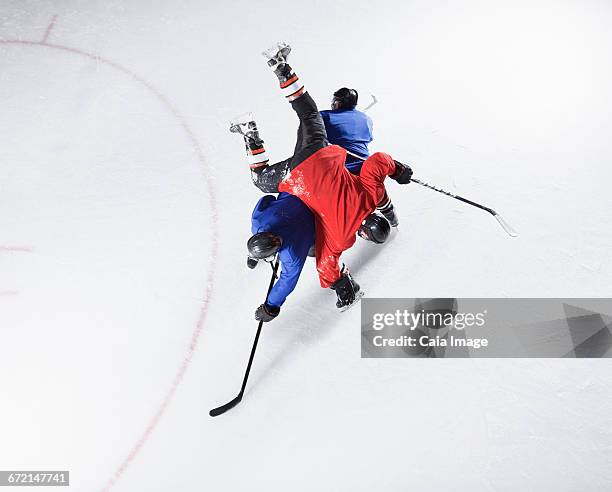 hockey players colliding on ice - defenseman ice hockey stock pictures, royalty-free photos & images