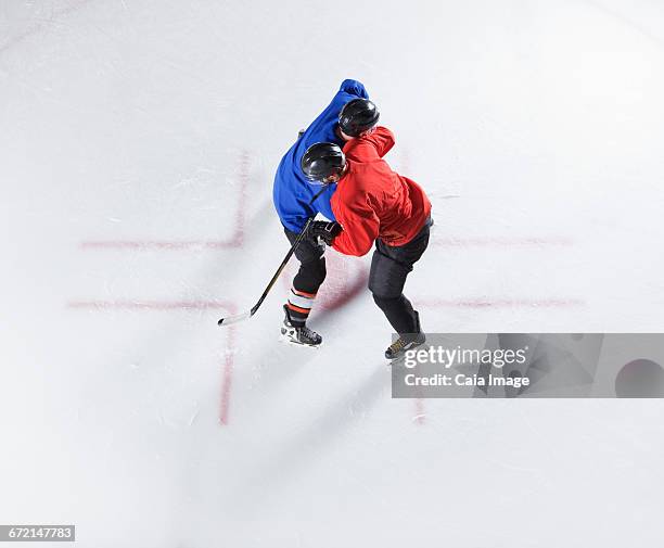 overhead view hockey opponents colliding - ice rink overhead stock pictures, royalty-free photos & images