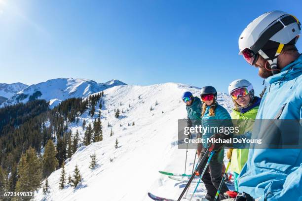 friends on skis standing on snowy mountaintop - taos fotografías e imágenes de stock