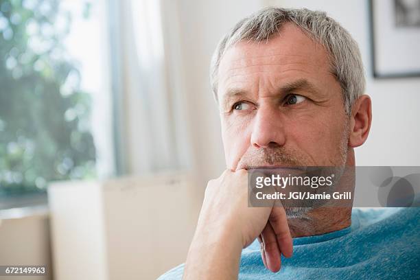 pensive older caucasian man - gray hair stress stock pictures, royalty-free photos & images