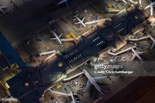 aerial view of airplanes parked in airport gates - airport aerial imagens e fotografias de stock