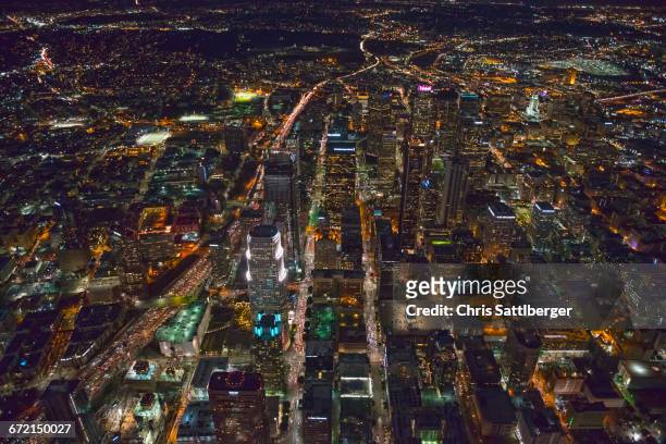 aerial view of los angeles cityscape lit up at night, california, united states - downtown los angeles aerial stock pictures, royalty-free photos & images