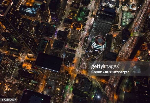aerial view of los angeles cityscape lit up at night, california, united states - downtown los angeles aerial stock pictures, royalty-free photos & images
