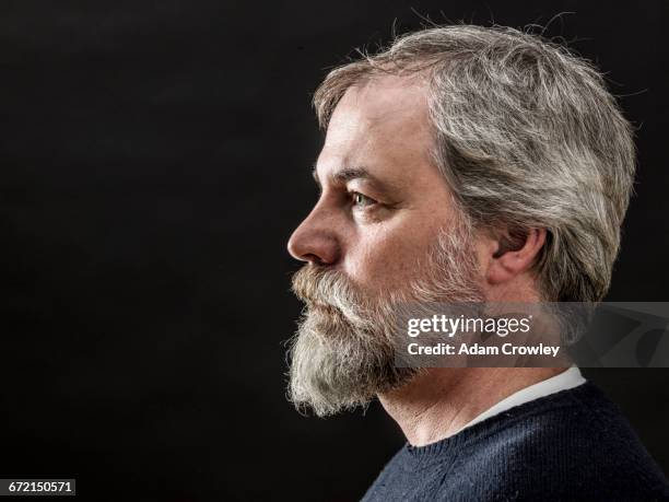 profile of caucasian man with beard - bart stock-fotos und bilder