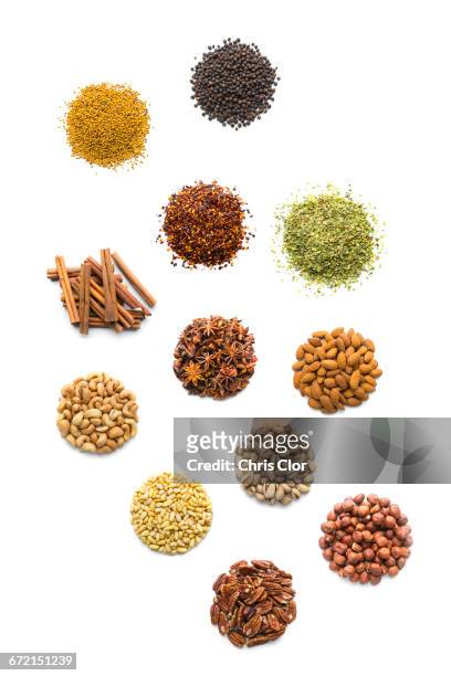 piles of nuts and seasonings - anise stockfoto's en -beelden