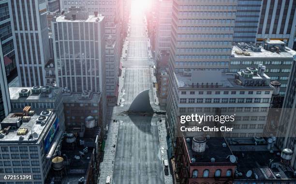 shark fin swimming in intersection of city streets - shark top view stock pictures, royalty-free photos & images