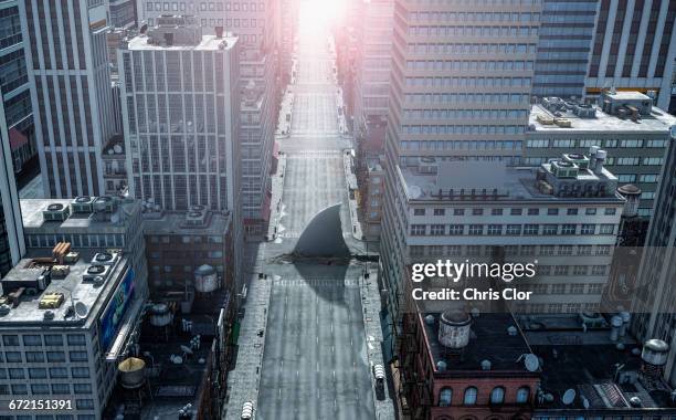 shark fin swimming in intersection of city streets - shark fin stock pictures, royalty-free photos & images