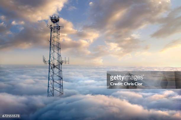 cellular tower above clouds - telecommunications tower stock pictures, royalty-free photos & images
