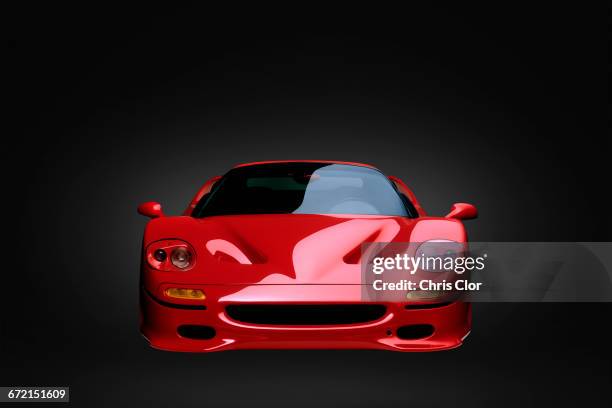 front view of shiny red sports car - ferrari fotografías e imágenes de stock