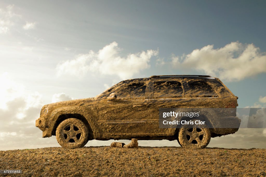 Sports utility vehicle covered in mud