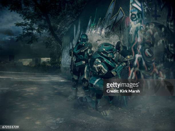 robots patrolling city holding rifle - us army urban warfare stock pictures, royalty-free photos & images