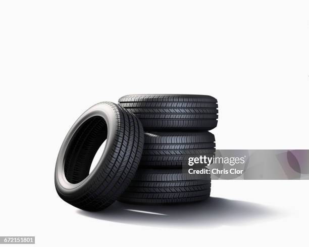 pile of tires on white background - autoband stockfoto's en -beelden