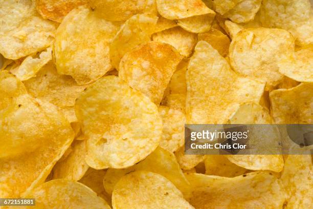 pile of potato chips - crisps stockfoto's en -beelden