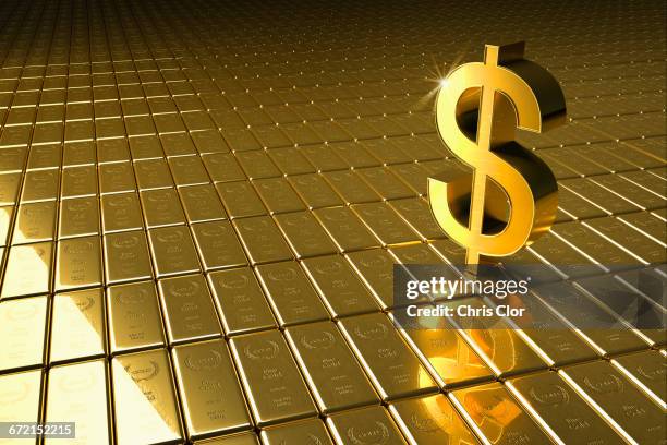 high angle view of gold bars and dollar symbol - gold bars ストックフォトと画像