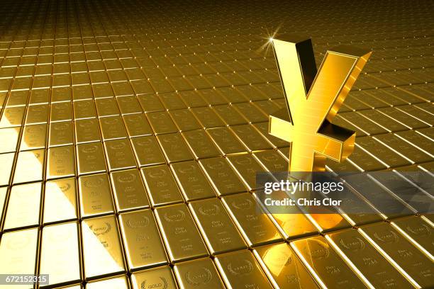 high angle view of gold bars and yuan symbol - yuan symbol stock-fotos und bilder