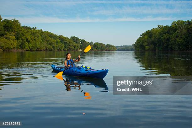 mixed race woman kayaking in river - life jacket isolated stock pictures, royalty-free photos & images