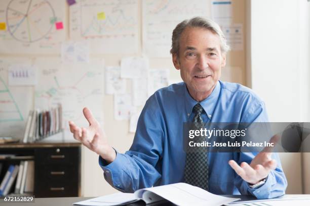 older caucasian businessman gesturing in office - shirt and tie close up stock pictures, royalty-free photos & images