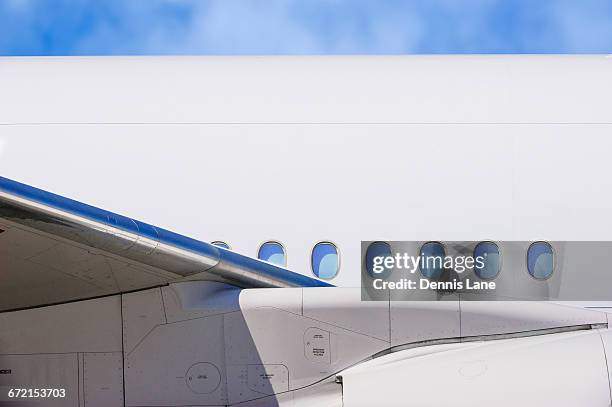 wing and windows on airplane - aircraft wing stock pictures, royalty-free photos & images