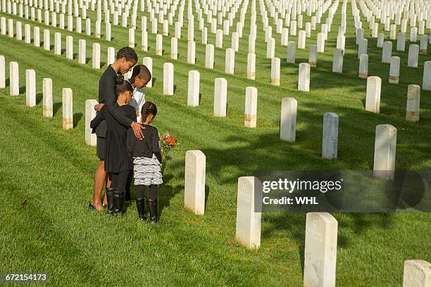 black family at military cemetery - african american funeral stock-fotos und bilder