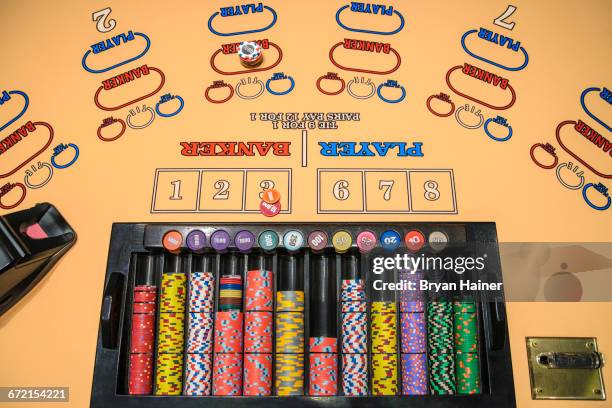 gambling chips at baccarat table - baccarat table stock pictures, royalty-free photos & images