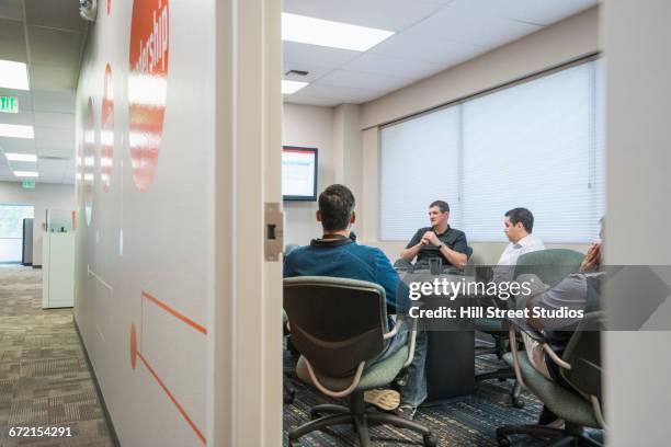 businessmen meeting in conference room - office doorway stock pictures, royalty-free photos & images